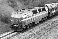 DSB MZ 1425 (type II) photographed in Fredericia - heading for Vejle. 15. January 1978. The MZ class (type I and II) was purchased from 1967 to 1970 in a number of 26. Only a few of these engines remain in service by DSB - most are now sold to other companies. Built by NOHAB and Frichs. Dieselelectric. Co'Co'. 2270 kW - 3300 hp. Max speed 143 km/h - 89 mph. Length 20 800 mm. Weight 116,5 metric tonnes. MZ 1425 was from 2001 to 2003 leased to Railion. In 2004 MZ 1425 was fittet with automatic couplers for transport of the IC4 test train set from Ansaldobreda.
